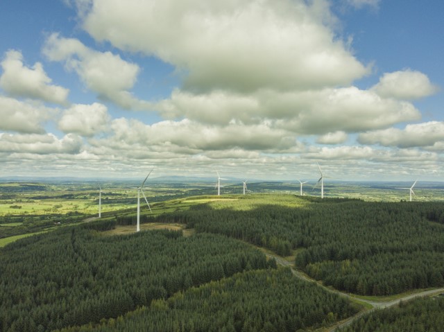Image of hills with wind turbines in the distance